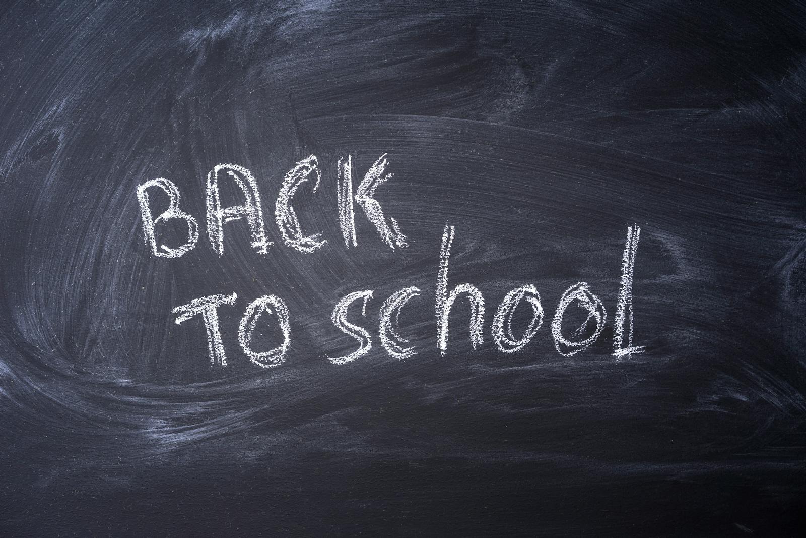 Blackboard with 'Back to School' written in chalk, ideal for educational themes.